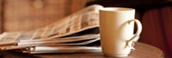 Image: coffee cup and newspaper
